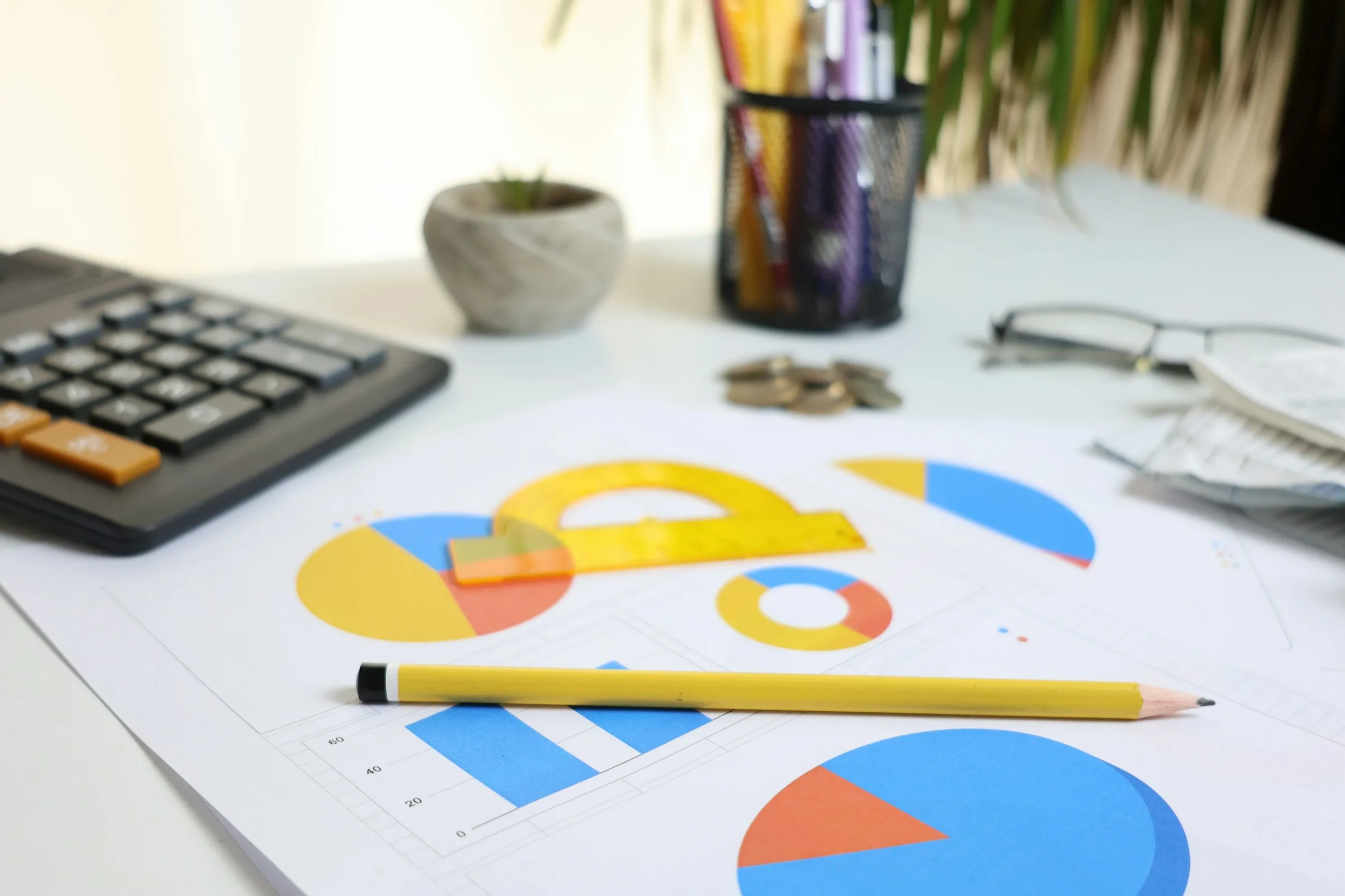 Financial charts and reporting documents on a desk