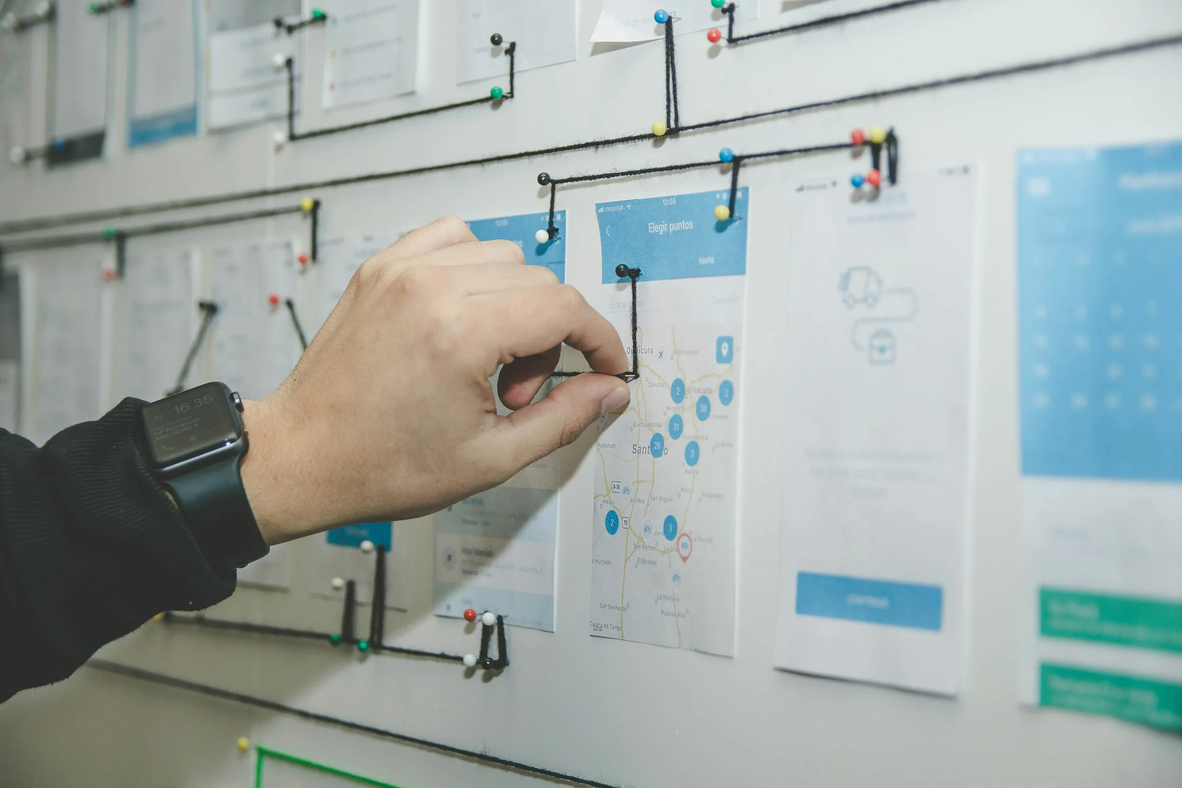 Product planning board with app screens and connections